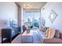 Bright living room featuring floor-to-ceiling windows with beautiful city views at 860 Peachtree Ne St # 1613, Atlanta, GA 30308
