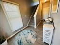 Inviting entryway featuring a staircase, stylish rug, and decorative console table for a warm welcome at 3615 Hawthorne Terrace, Atlanta, GA 30337