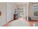 Bright foyer featuring hardwood floors, decorative rug and stylish entryway at 3476 Bridge Walk Drive, Lawrenceville, GA 30044