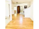 Inviting foyer with hardwood floors and views into other living spaces at 665 Roxford Ln, Buford, GA 30518