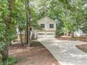 Charming two-story home with a two-car garage, a front porch, and a driveway at 459 Bakers Bridge Cir, Douglasville, GA 30134