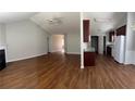 Open-concept living space with hardwood floors and natural light at 802 Village Pl, Loganville, GA 30052