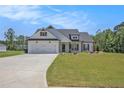 Charming single-Gathering home featuring a 2-car garage, craftsman design, and beautiful landscaping at 461 Barnwood Dr, Rockmart, GA 30153