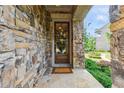 Charming entryway featuring a stone facade and decorative wreath at 502 Abbington River Ln, Atlanta, GA 30339