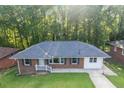 A lovely home featuring a new roof, beautiful lawn, and landscaped backyard perfect for outdoor activities and relaxation at 2773 Fairlane Dr, Atlanta, GA 30354