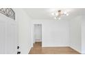 Bright foyer featuring fresh paint, attractive light fixture, and beautiful hardwood flooring at 2773 Fairlane Dr, Atlanta, GA 30354