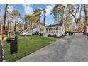 Beautiful home with a well-kept lawn and driveway leading to the front, creating curb appeal at 2912 Palm Dr, East Point, GA 30344
