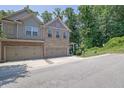 Beautiful townhome featuring a two-car garage and a blend of brick and siding accents at 2333 White Oak Se Bnd, Smyrna, GA 30080