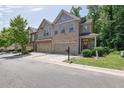 Attractive townhome with a 2-car garage, complimented by brick and siding for a modern look at 2333 White Oak Se Bnd, Smyrna, GA 30080