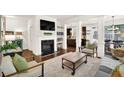 Cozy living room featuring a fireplace, hardwood floors, and stylish contemporary furniture at 2333 White Oak Se Bnd, Smyrna, GA 30080