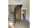 Inviting entryway with modern staircase and sleek hardwood floors at 4601 Tall Pines Nw Dr, Atlanta, GA 30327