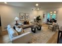 Cozy living room with neutral tones, stylish furniture, and modern lighting at 4601 Tall Pines Nw Dr, Atlanta, GA 30327