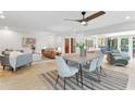 This spacious and bright living room features a decorative ceiling fan, modern furnishings, and open floor plan at 4601 Tall Pines Nw Dr, Atlanta, GA 30327
