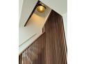 Close-up on a modern staircase with warm wood accents and stylish lighting at 4601 Tall Pines Nw Dr, Atlanta, GA 30327