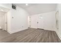 Bright living room with sleek, modern flooring and fresh white walls, creating a clean, open space at 2174 Rexford Dr, Decatur, GA 30034