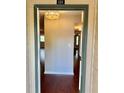 Condo entryway with decorative lighting and hardwood floors at 121 Brittany Ct, Duluth, GA 30096