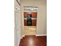 An eat-in kitchen featuring wood cabinets and black appliances at 121 Brittany Ct, Duluth, GA 30096