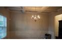 Dining room displaying the chandelier and trim work along the wall at 1504 Gallup Dr, Stockbridge, GA 30281