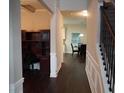 Hallway features a built-in office and staircase with iron railing at 1504 Gallup Dr, Stockbridge, GA 30281