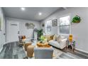 Bright living room with vaulted ceilings, new gray vinyl floors, and contemporary decor at 2162 Westover Dr, Atlanta, GA 30344