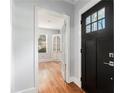 Home entryway with hardwood floors and view to an office/flex space with built-ins at 2701 Log Cabin Se Dr, Atlanta, GA 30339