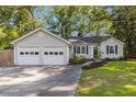 Beautiful home featuring a convenient two-car attached garage and manicured lawn at 2701 Log Cabin Se Dr, Atlanta, GA 30339