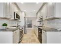 Modern kitchen featuring granite countertops, stainless steel appliances, and ample cabinet space at 4870 Twin Lakes Trail, Atlanta, GA 30360