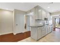 Well-lit kitchen with granite countertops, white cabinetry, and an adjacent dining area at 4870 Twin Lakes Trail, Atlanta, GA 30360