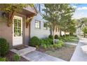 Charming entryway with white door and wood beam detailing, complemented by manicured landscaping at 126 Chestnut Cir, Atlanta, GA 30342