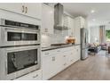 Modern kitchen boasts stainless appliances, stylish cabinetry, and an open layout at 1088 Battery Park Rd, Decatur, GA 30033