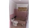 Outdated pink bathroom, offering a vintage charm, ready for a modern upgrade and renovation at 1101 Isa Se Dr, Atlanta, GA 30315