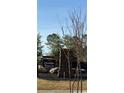 Klondike Reserve community entrance sign with stone base and natural landscaping at 216 Seward St # 93, Conyers, GA 30094
