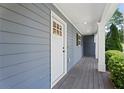 Charming front porch featuring classic columns and a stylish wood plank floor at 2067 Kinridge Ct, Marietta, GA 30062