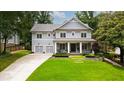 Charming two-story home with a manicured front yard and a two-car garage at 4048 Navajo Trl, Brookhaven, GA 30319