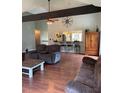 Comfortable living room includes hardwood floors, ceiling fan and view into the kitchen bar seating area at 17 Country Walk, Cartersville, GA 30121