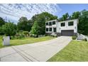 Beautiful two-story white-brick home on a manicured lot, featuring a two-car garage and a lengthy driveway at 2804 Skyland Ne Dr, Brookhaven, GA 30341