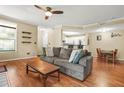 Inviting living room features hardwood floors, a ceiling fan, and access to the kitchen at 539 Mcgill Park Ne Ave, Atlanta, GA 30312