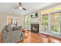 Comfortable living room with a fireplace and access to an outdoor patio at 539 Mcgill Park Ne Ave, Atlanta, GA 30312