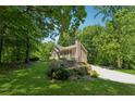 Single-story home with verdant lawn and landscaping at 6960 Worley Rd, Cumming, GA 30028