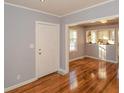 Bright entryway boasts hardwood floors with views of the kitchen at 1496 S Hairston Rd, Stone Mountain, GA 30088