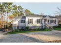 Charming home with a well-maintained lawn and mature trees at 1496 S Hairston Rd, Stone Mountain, GA 30088