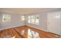 Inviting living room boasts hardwood floors and plenty of natural light at 1496 S Hairston Rd, Stone Mountain, GA 30088