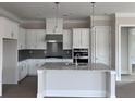 Modern kitchen with stainless steel appliances, white cabinets, and a granite countertops at 404 Vinca Nw Cir, Kennesaw, GA 30144