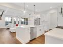 Bright kitchen with an island, stainless steel appliances, and an open floor plan at 118 Via Roma, Woodstock, GA 30188