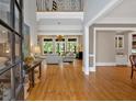 Inviting foyer showcasing hardwood floors, high ceilings, and an open view to the living room at 511 Etris Ct, Roswell, GA 30075