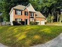 Attractive brick two-story home with an attached two-car garage and a landscaped front yard at 108 Northcutt Station Pl, Acworth, GA 30101