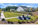 Community lawn with Adirondack chairs providing a relaxing outdoor space at 199 Vinca Nw Cir, Kennesaw, GA 30144