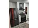 Modern kitchen features stainless steel appliances including a refrigerator, and stove at 2493 Springdale Rd, Atlanta, GA 30315