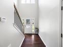 Bright foyer with hardwood floors, staircase, and a high ceiling that creates an open feel at 1016 Buckeye Ln, Villa Rica, GA 30180