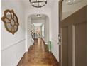 Inviting home foyer boasts gleaming hardwood floors and decorative wall accents at 2396 Whiteoak Se Bnd # 16, Smyrna, GA 30080
